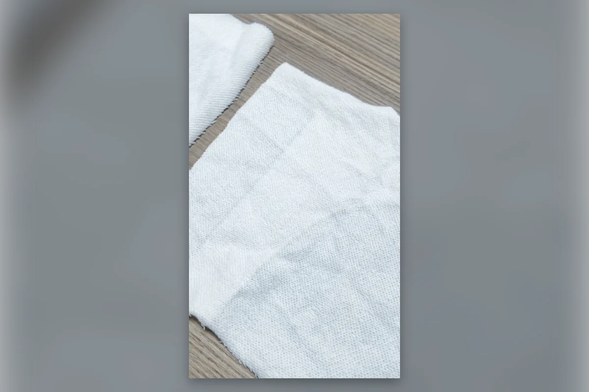 Two visually similar fabrics compared before approving a clothing manufacturing quote
