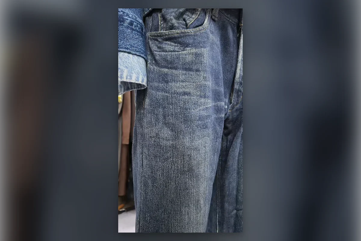 Close-up of realistic fading and pocket details on a printed faux jean sample