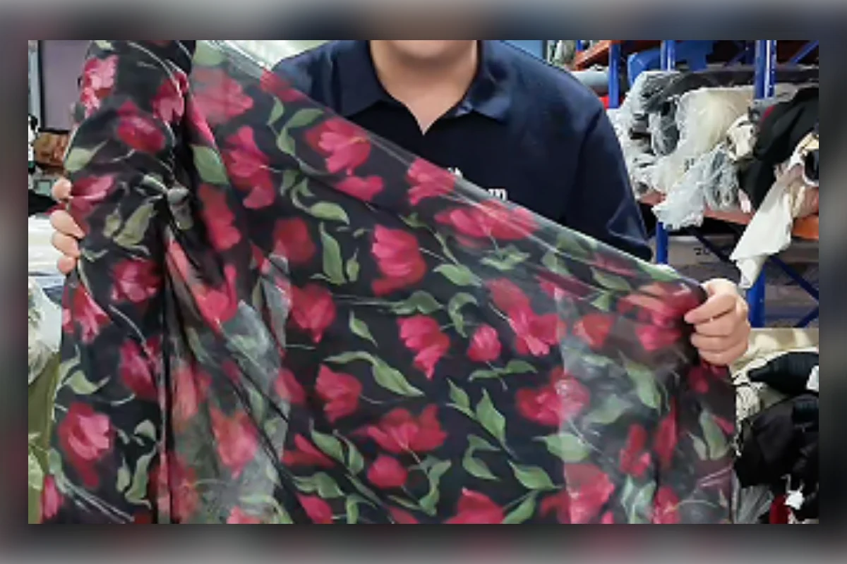 Shengfu developer holding custom floral fabric that may carry a supplier MOQ