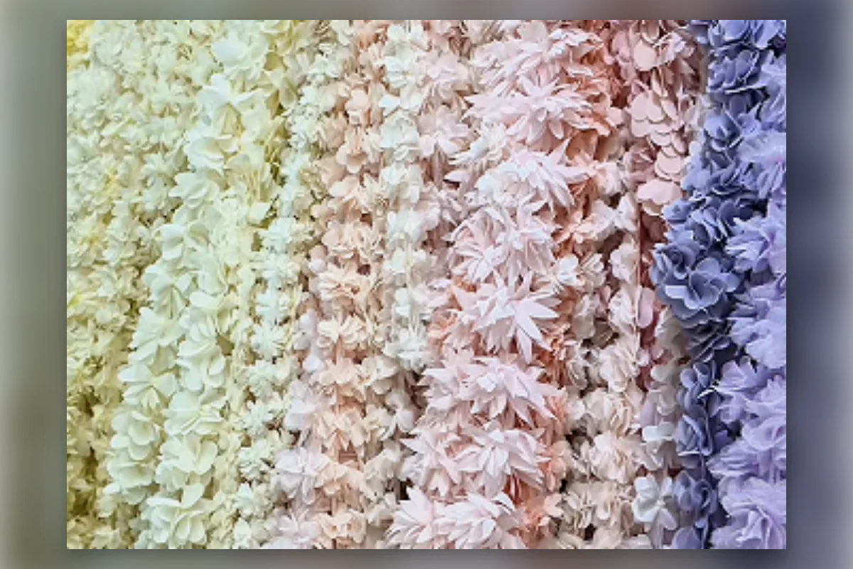 Rows of floral trims used for complex womenswear production
