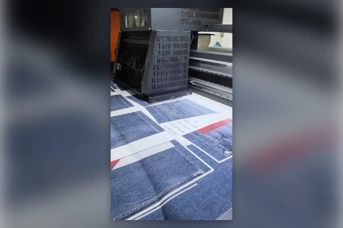 Wide-format textile printer producing fake denim pattern panels