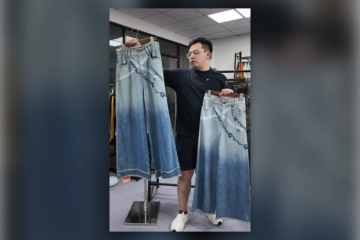 Shengfu product developer comparing two faux denim pants samples