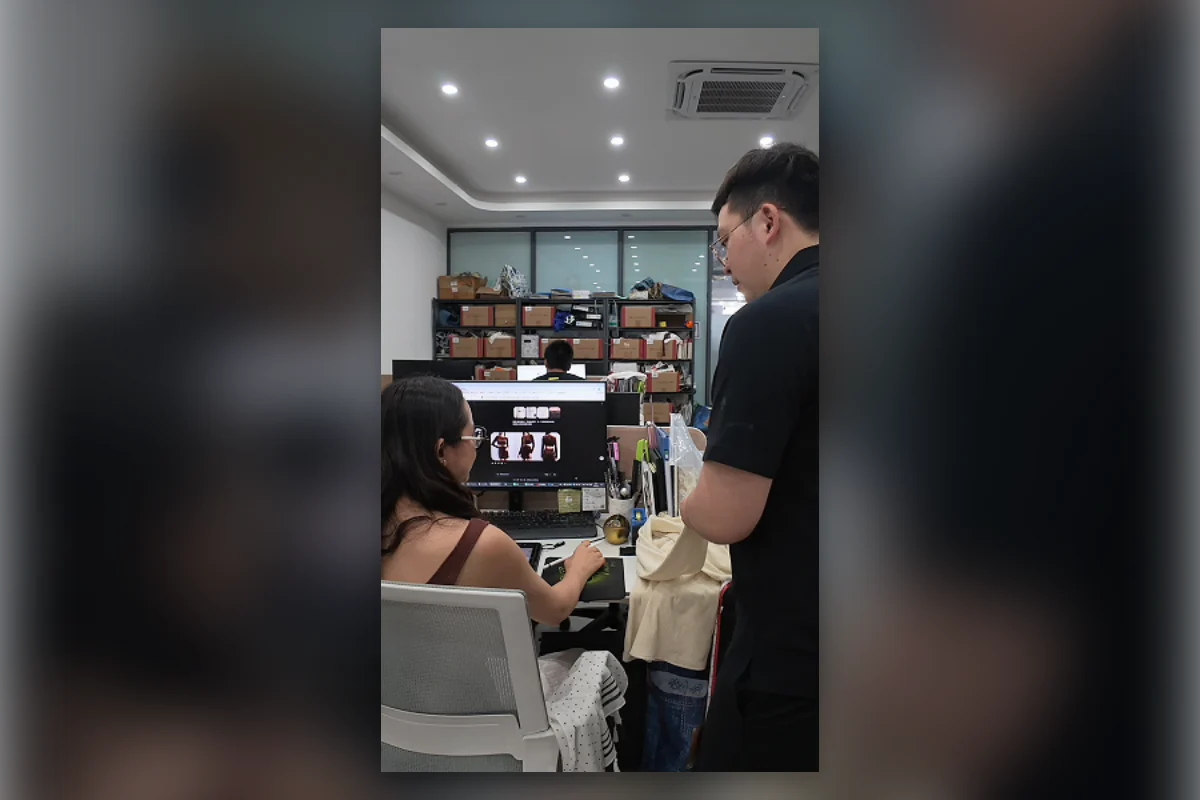 Shengfu womenswear development team reviewing an AI design, Tech Pack and sample garment