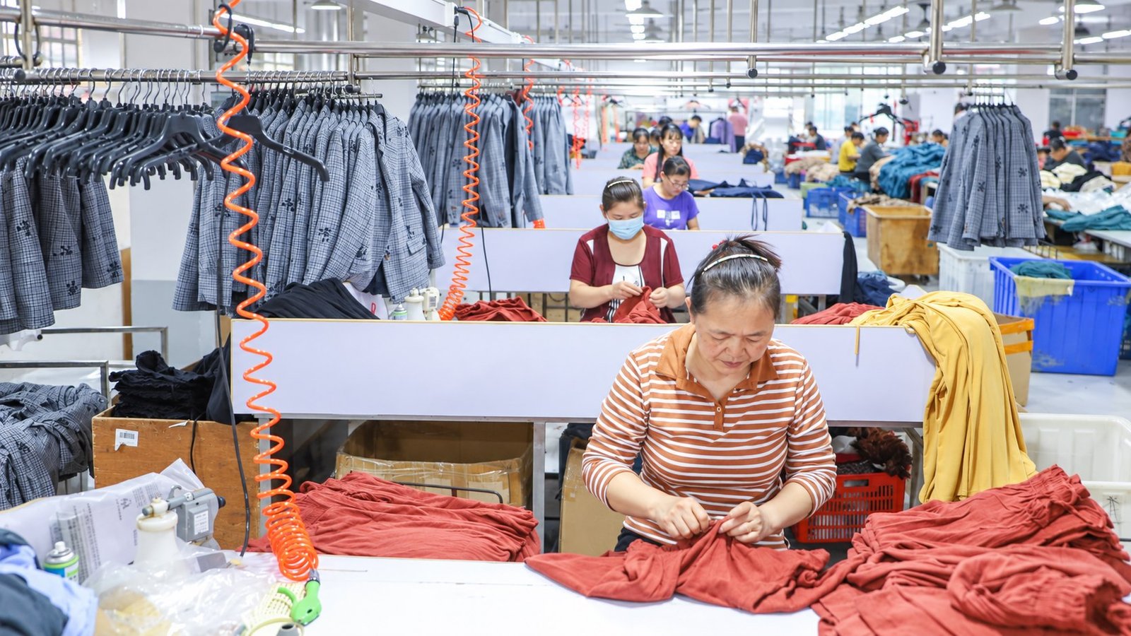 Shengfu garment quality inspectors checking finished garments