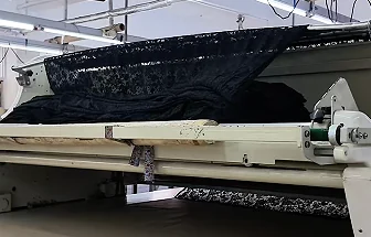 Fabric passing through processing equipment