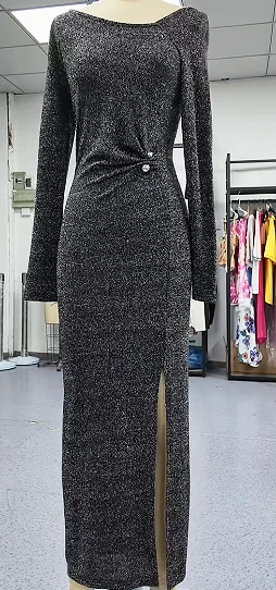 Long dark dress with restrained detailing on a dress form