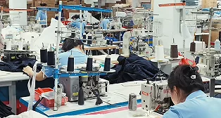 Workers at garment sewing stations