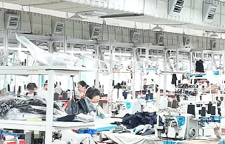 Rows of sewing workstations in a garment factory
