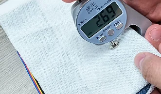 Digital gauge measuring fabric thickness