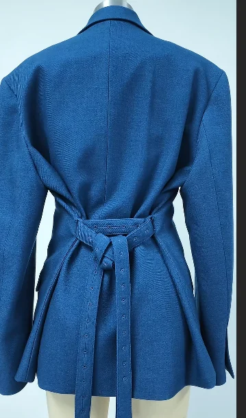 Back of a blue belted jacket