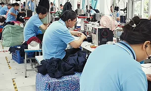 Garment workers at production workstations