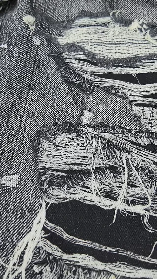 Close-up of an abraded denim-looking surface