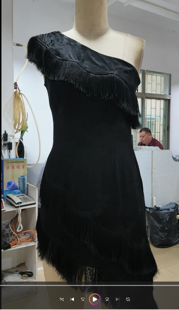 Black dress with asymmetric shoulder on a form