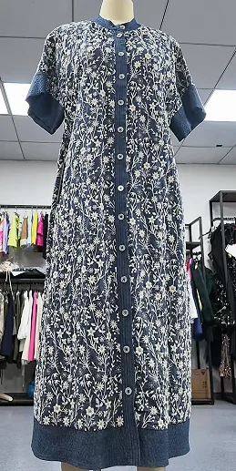 Rear view of a dark floral dress on a form