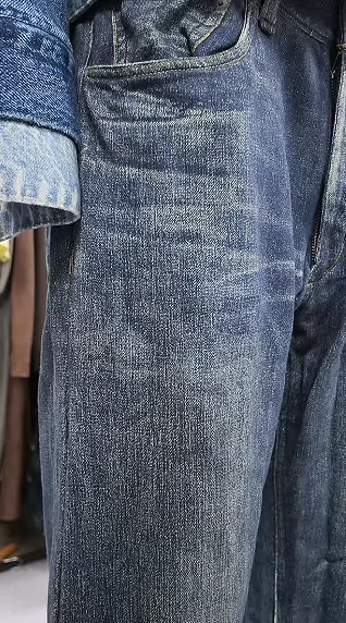 Close-up of a jeans seam and fabric surface