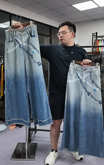 Man comparing two denim-style garments