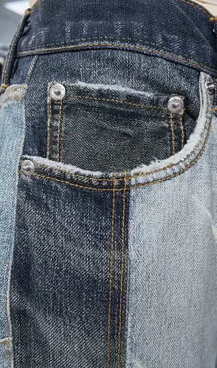 Close-up of a jeans pocket and stitching