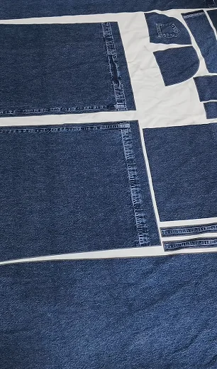 Paper cutting templates positioned on blue fabric