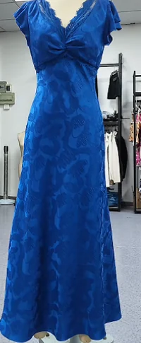 Blue dress on a mannequin with shaped bodice and skirt